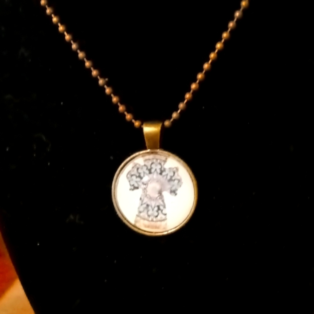 Round glass pendant cross necklace with chain. Blue and cream cross